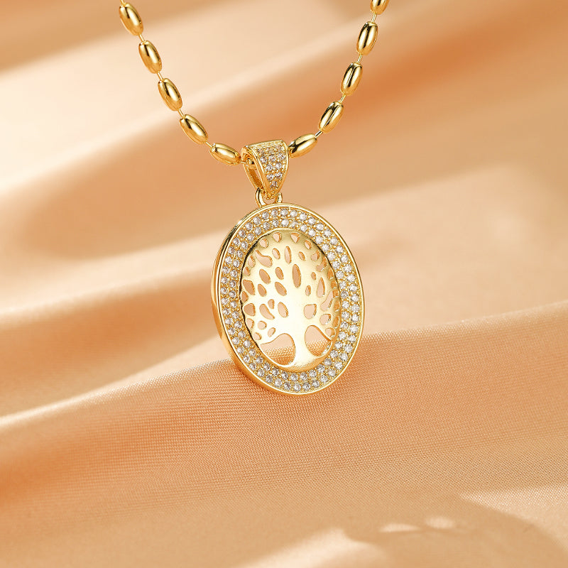 COLLIER EN ACIER DORE PENDENTIF COEUR AVEC ABRE DE VIE