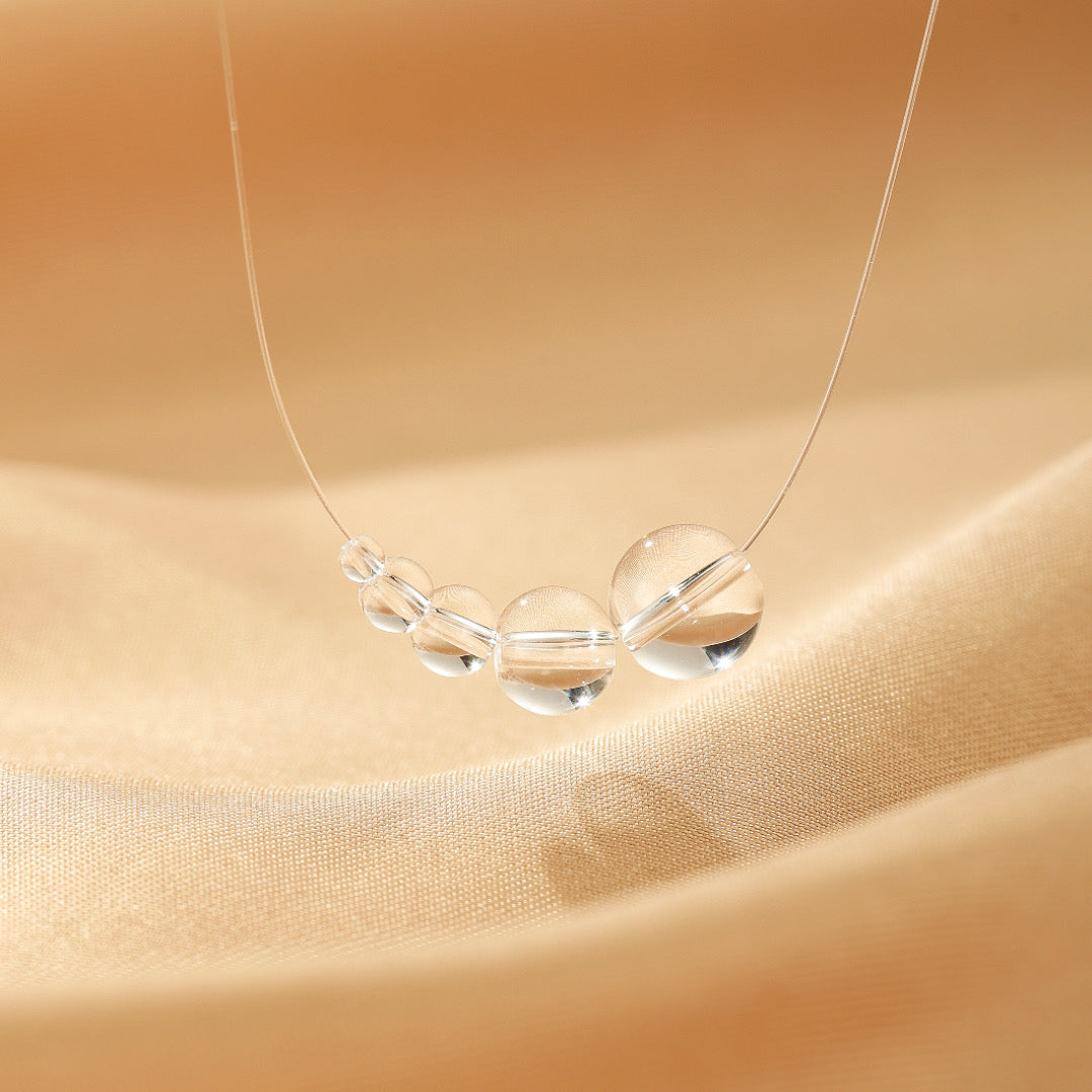 Collier Flottant Quartz Clair – Voile Lumineux