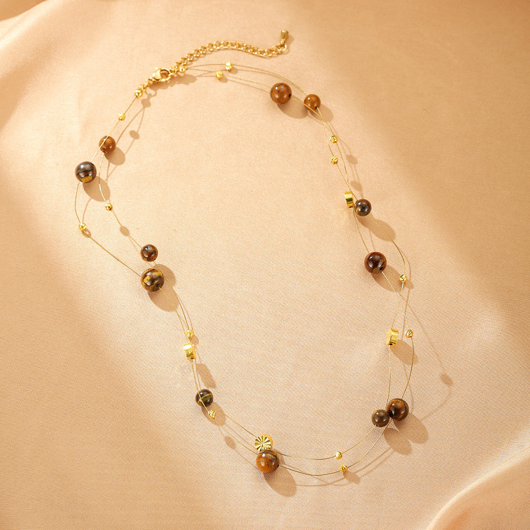 Collier Flottant Œil de Tigre – Sagesse Dorée