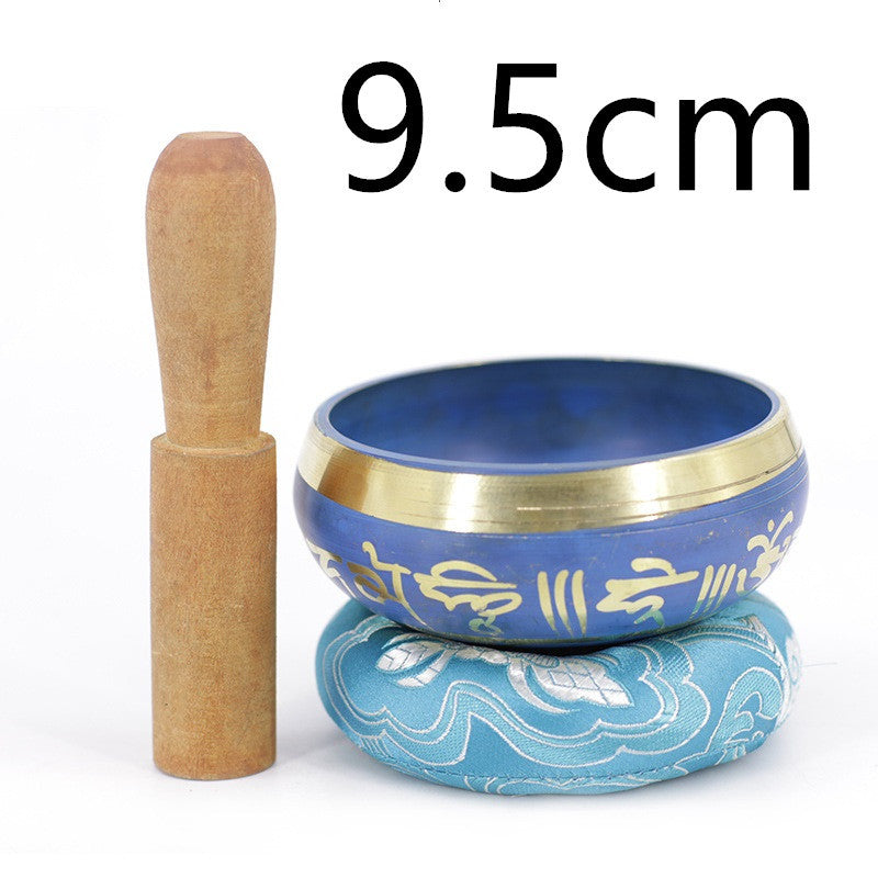 Bol chantant tibétain bleu de 9.5cm avec un maillet en bois et un coussin assorti décoré de mantras dorés.