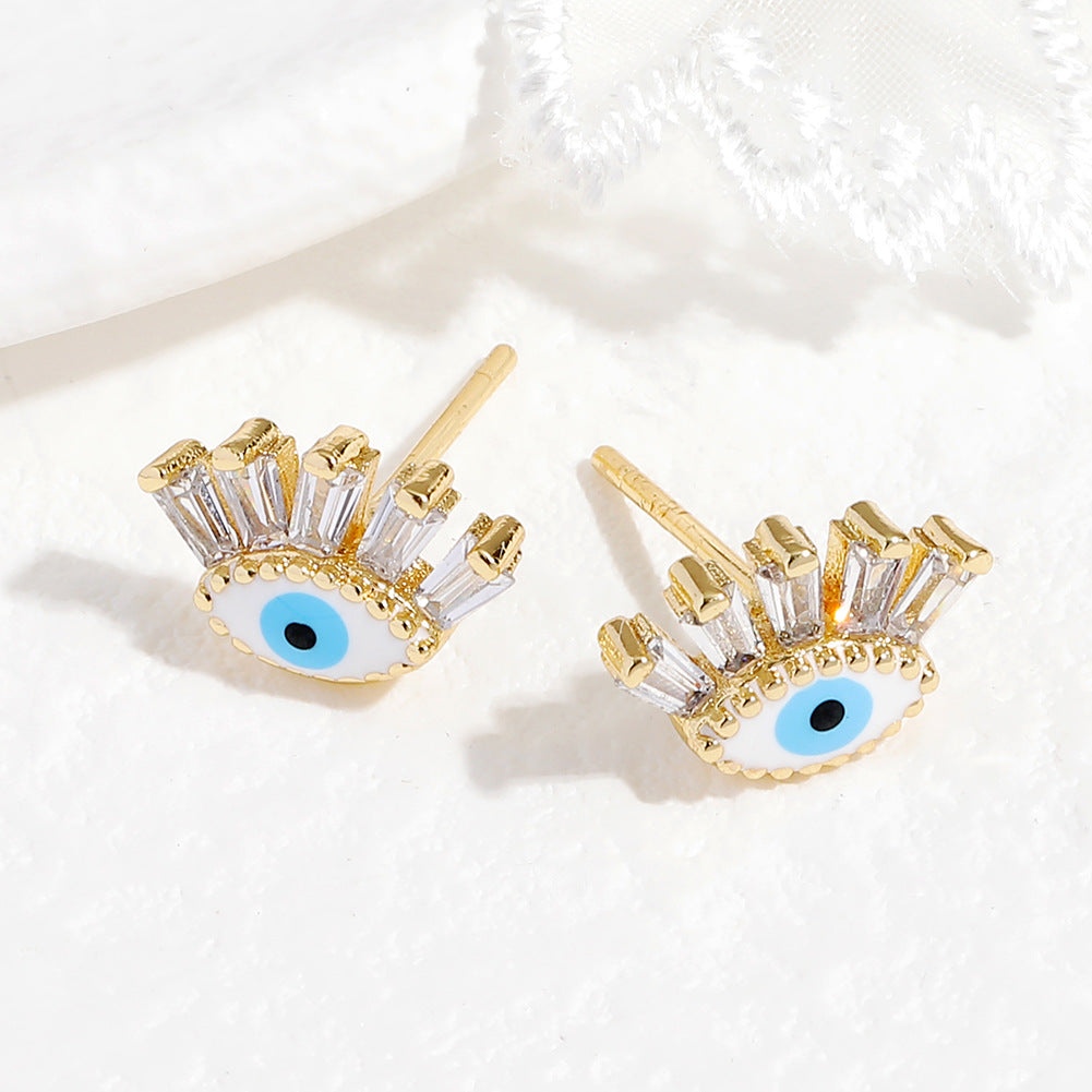 Boucle d’oreille Mauvais Œil « Regard » en cristal blanc et or