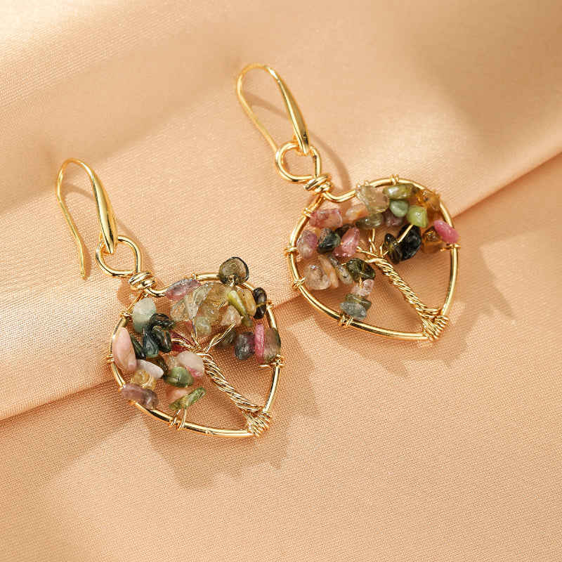 Boucles d'oreilles arbre de vie en forme de cœur avec des pierres d'améthyste et du cuivre.