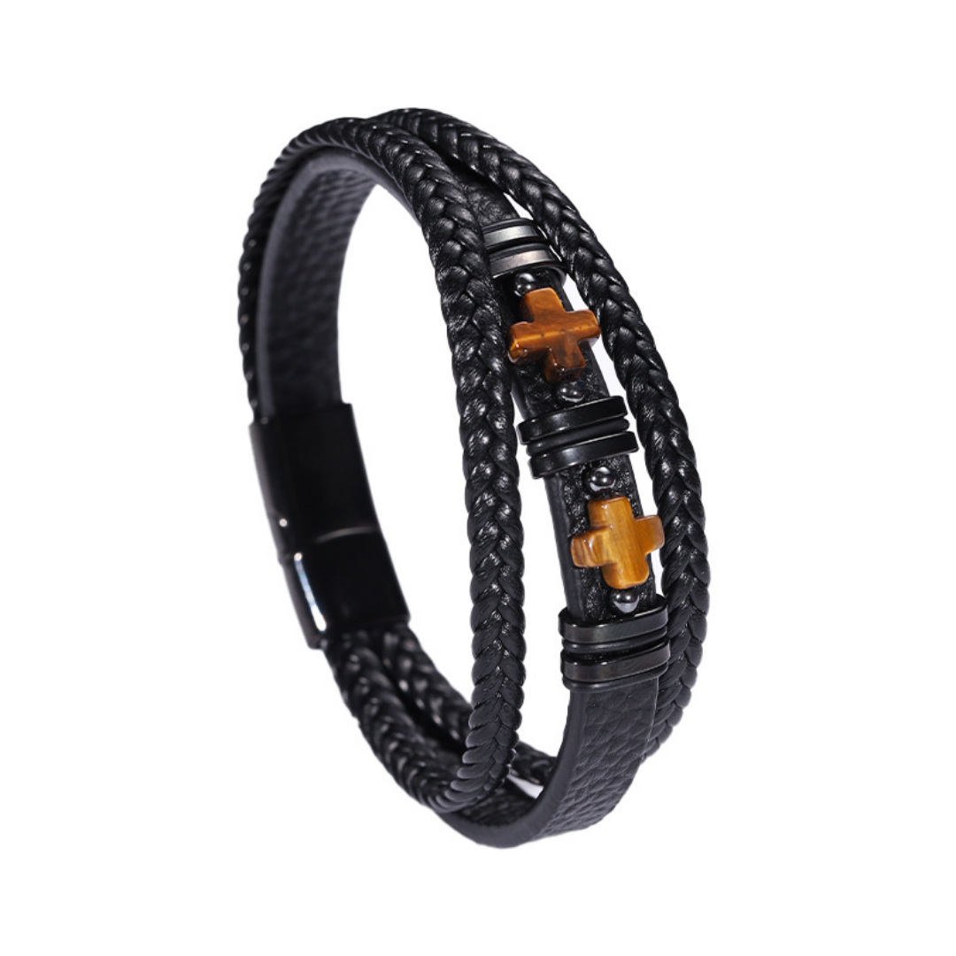 Bracelet pour homme en cuir noir tressé avec deux croix en œil de tigre et fermoir magnétique, symbolisant la double protection.