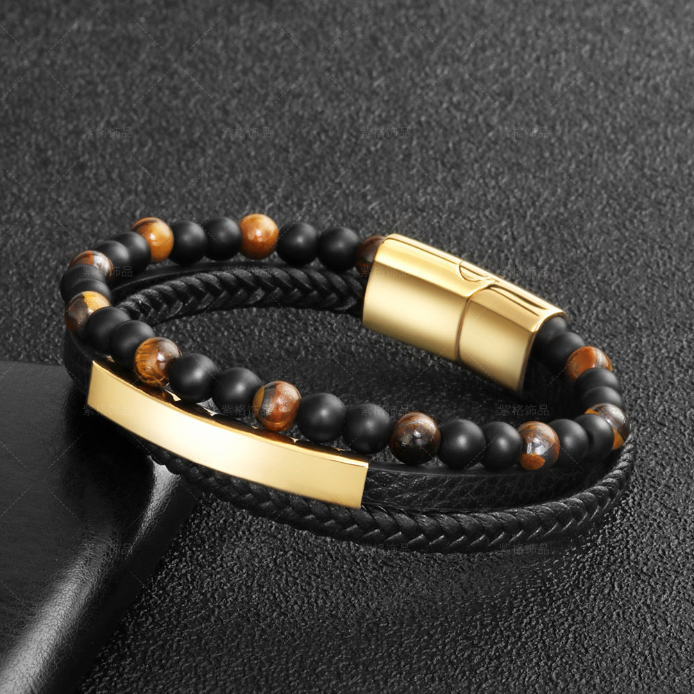 Bracelet en cuir tressé noir avec perles œil de tigre et onyx, fermoir magnétique doré et plaque gravable.