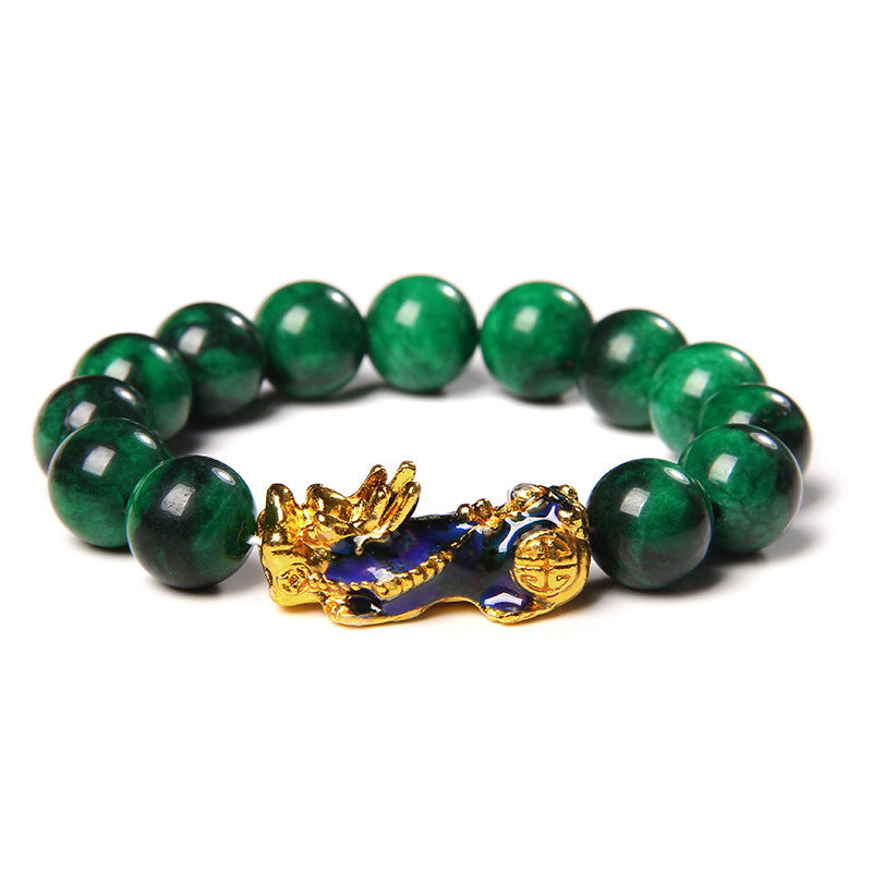 Bracelet "Harmonie Céleste" en jade vert avec une breloque dorée et bleue représentant un Pi Xiu.