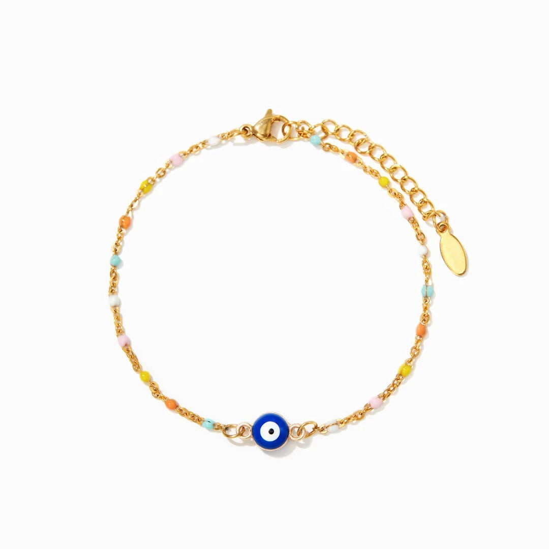 Bracelet "Confiance" en argent 925 avec un œil du mal bleu et blanc entouré de petites perles colorées sur une chaîne dorée