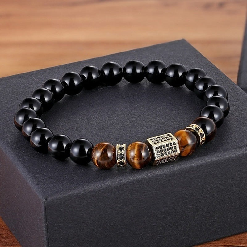 Bracelet "Hexagone" en onyx noir et œil de tigre avec un fermoir cubique doré orné de zircons noirs