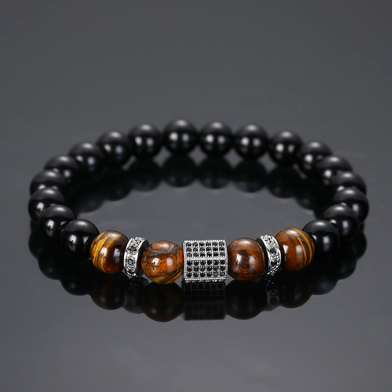Bracelet homme en onyx noir et œil de tigre avec un fermoir carré orné de strass noirs et argentés.