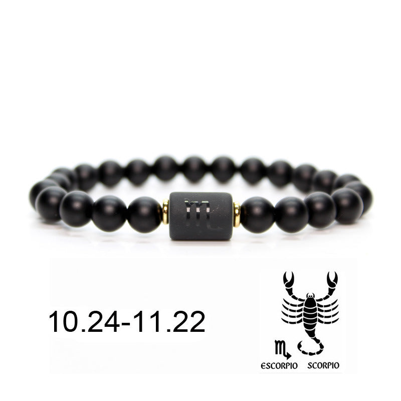 Bracelet en onyx noir avec le symbole astrologique du Scorpion "m" gravé sur une perle centrale, dates du signe 10.24-11.22 et illustration du Scorpion.