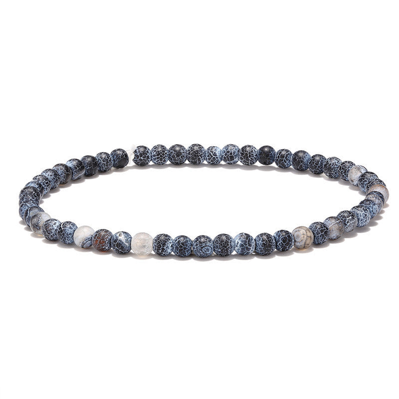 Bracelet Tibétain Trio Bénédiction avec des perles d'agate noires et blanches craquelées.