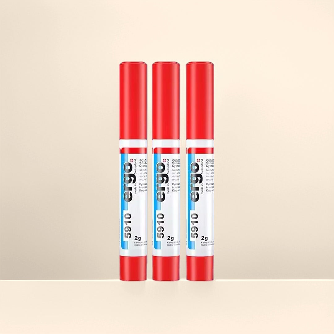 Trois stylos de colle de bijouterie Ergo 5910 de 2g chacun, avec caps rouges et corps blanc/bleu, pour une fixation invisible.