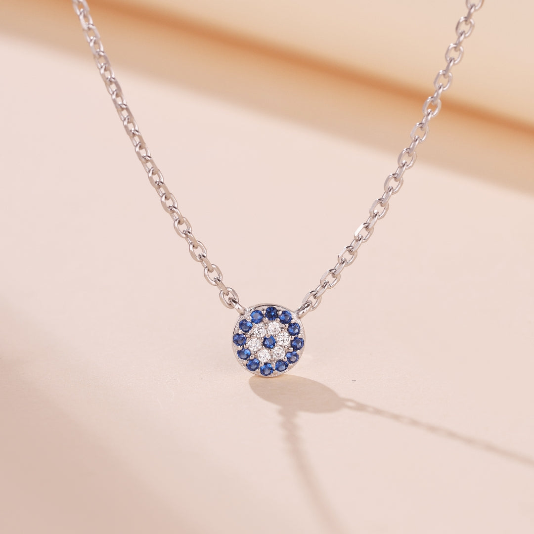 Pendentif œil bleu en argent 925 serti de saphirs et de diamants