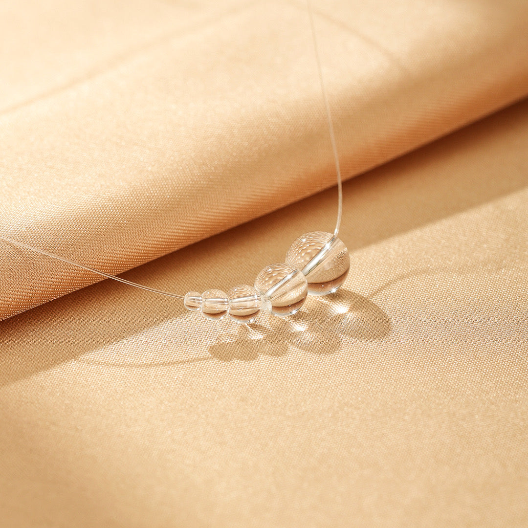 Collier Flottant Quartz Clair – Voile Lumineux