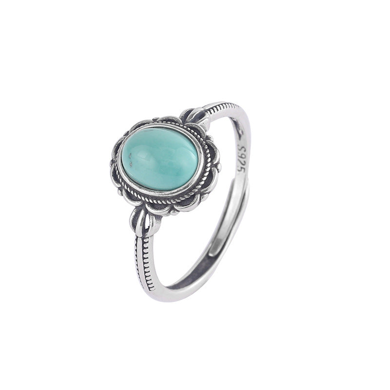 Bague ajustable en argent 925 ornée d'une pierre turquoise ovale et d'un design bohème délicat.