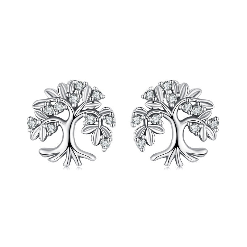 Paire de boucles d'oreilles en argent 925 représentant un arbre de vie stylisé, orné de petites pierres scintillantes.
