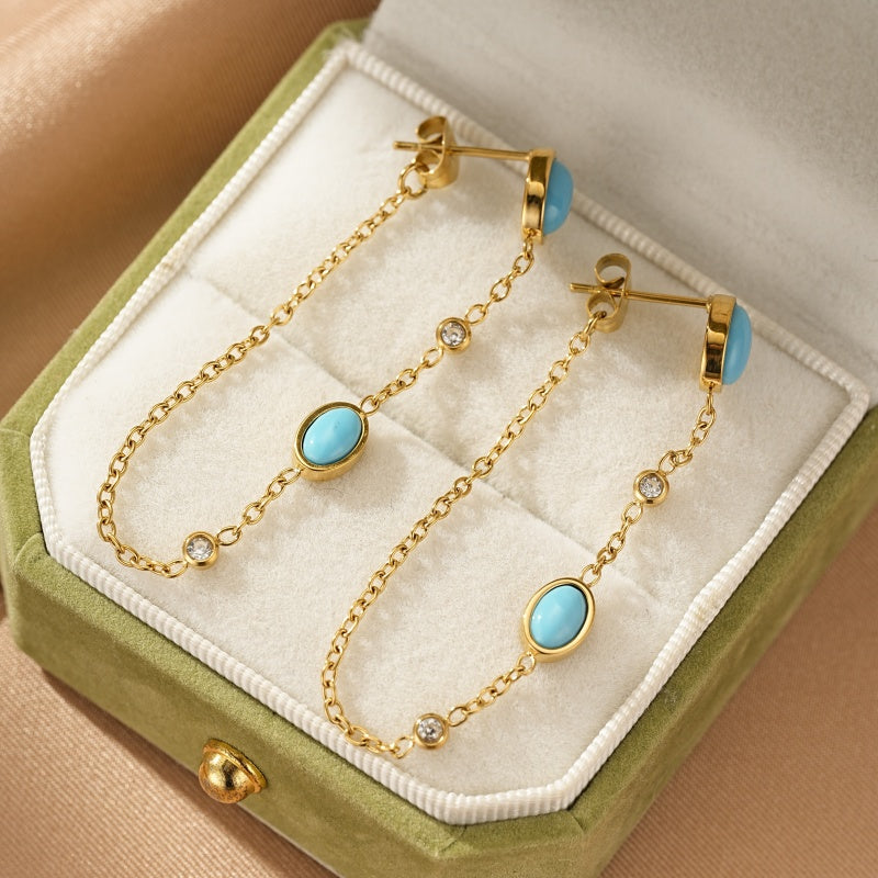 Boucles d'oreilles pendantes en or avec turquoise et diamants, style chaîne.
