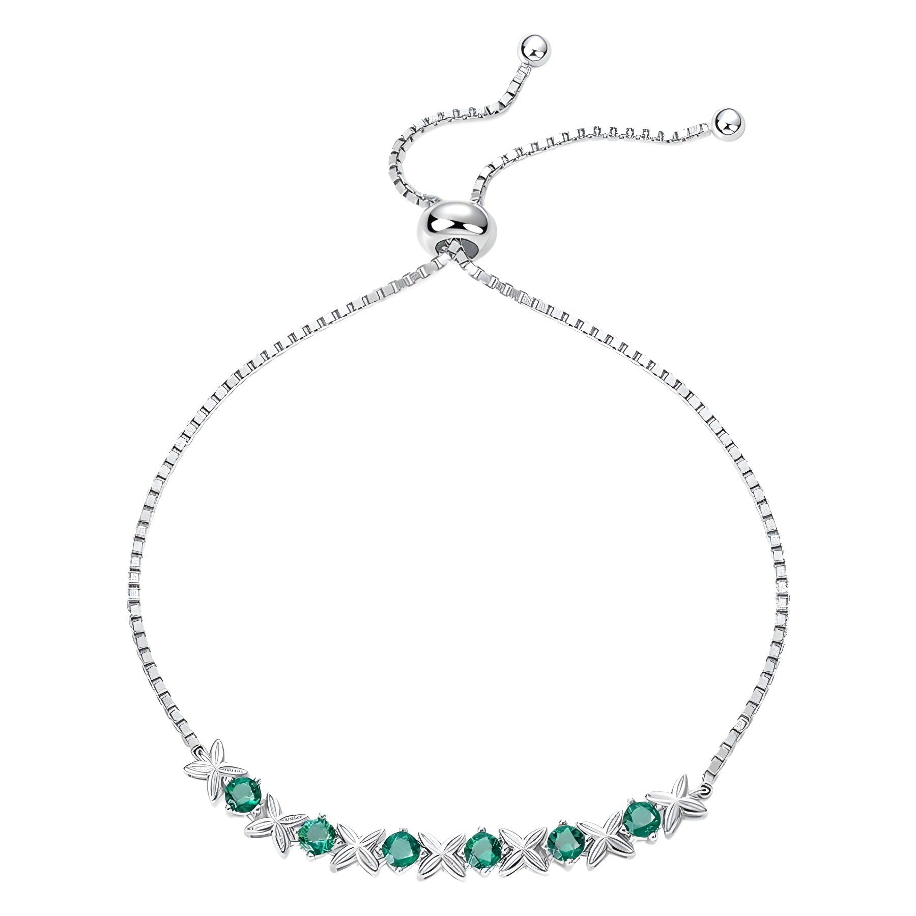 Bracelet jonc en argent avec des pierres d'émeraude et un motif floral en forme de X