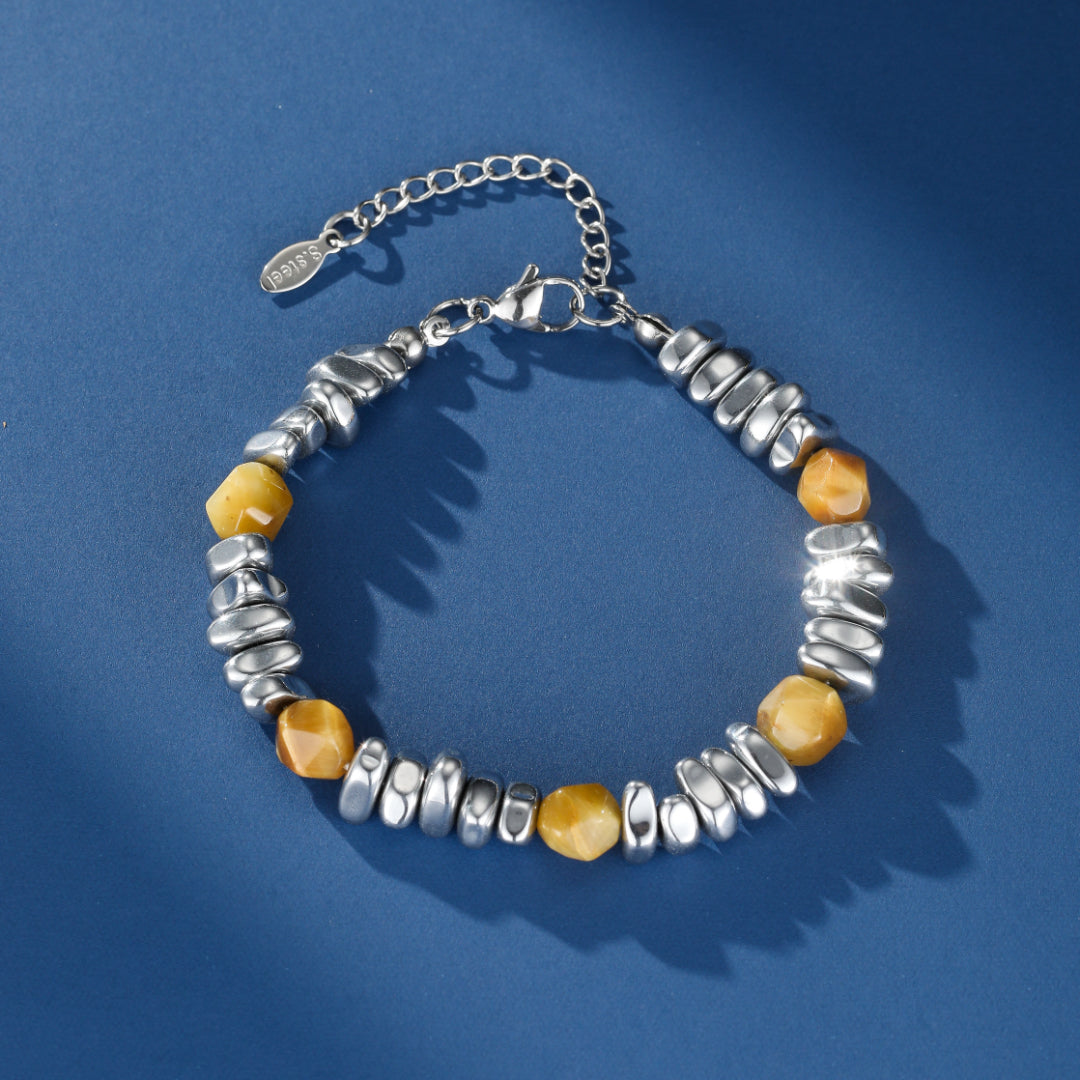 Bracelet pour homme en acier inoxydable et pierres naturelles œil de tigre, avec fermoir mousqueton et chaîne d'ajustement.