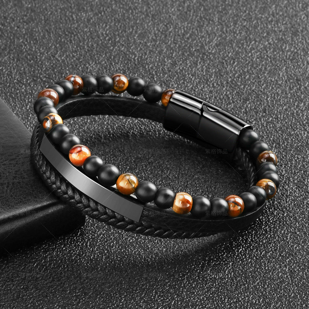 Bracelet en cuir noir tressé avec des perles œil de tigre marron et noires, fermoir magnétique noir.
