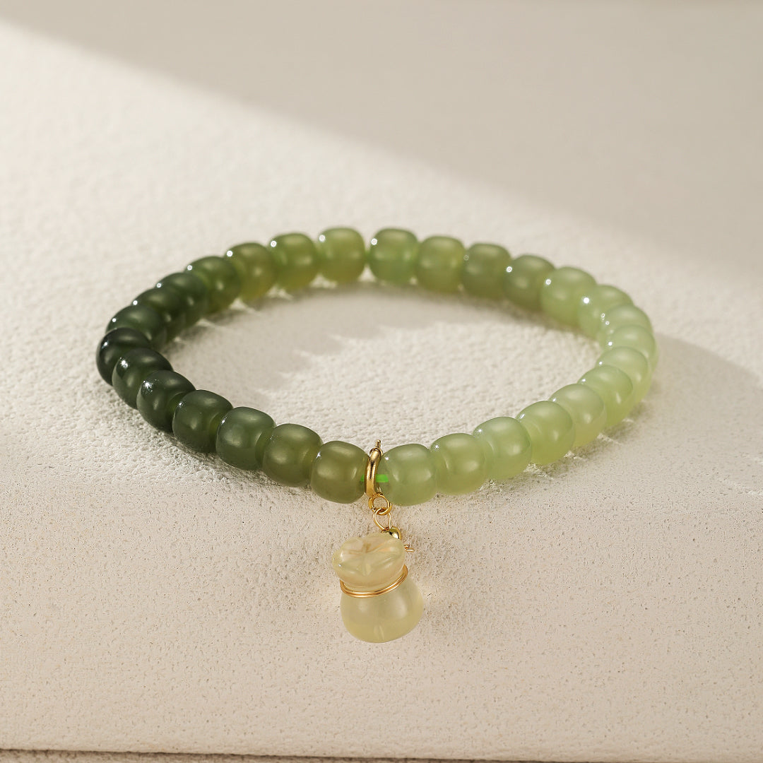 Bracelet Jade Poche d'Argent avec perles de jade AAA et citrine, attirant richesse et sérénité. Bijou ajustable pour l'abondance et la fortune.
