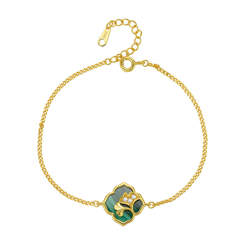 Bracelet en argent plaqué or avec un motif de trèfle en malachite incrusté d'un arbre de vie et de petits diamants.
