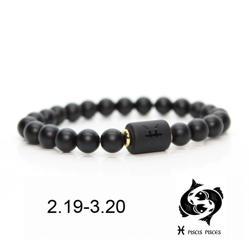 Bracelet en onyx noir avec un symbole astrologique des Poissons gravé sur une perle centrale et une date "2.19-3.20".