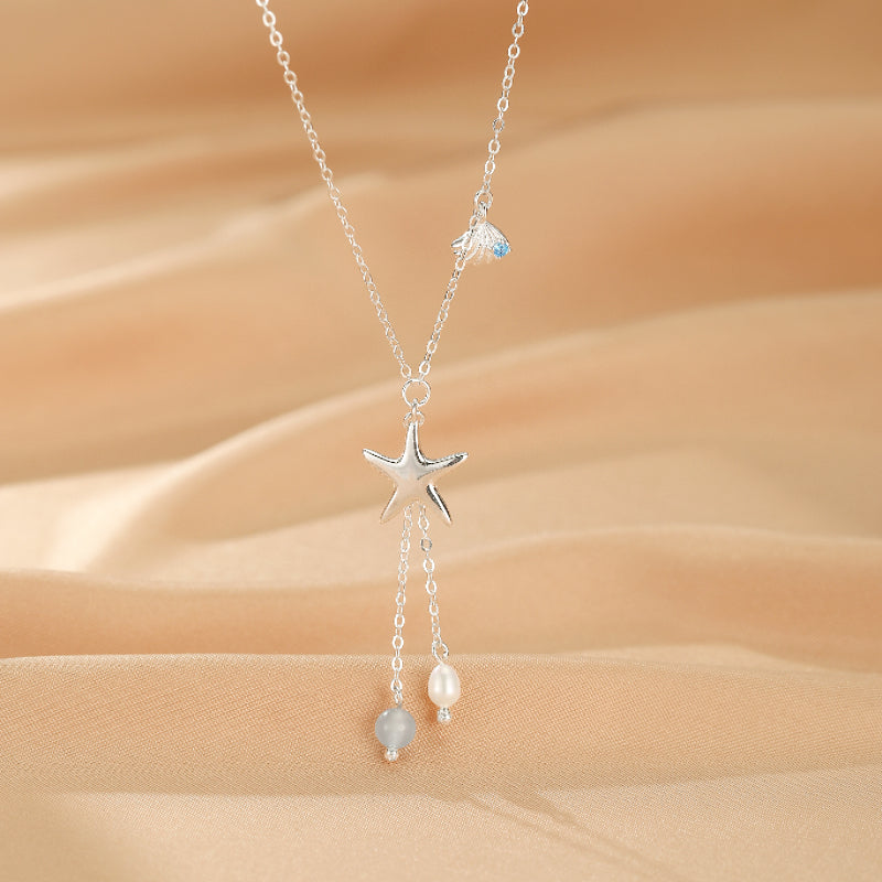 Collier en argent S925 avec un pendentif en forme d'étoile de mer, une aigue-marine bleue et une perle blanche, style marin
