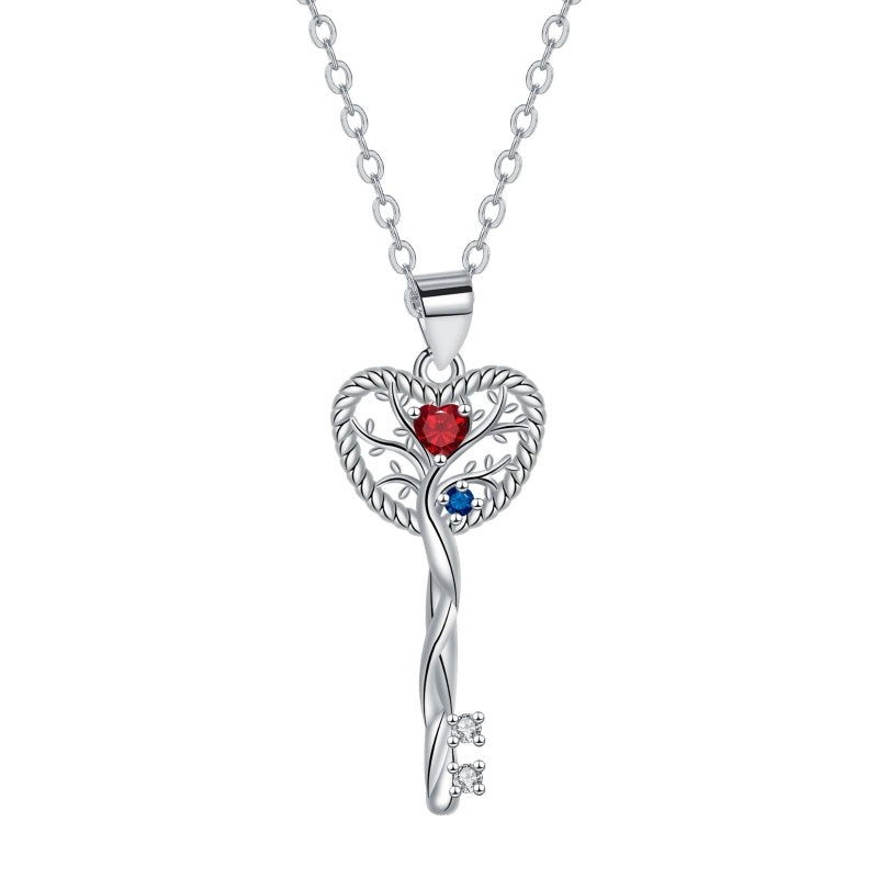 Collier Arbre de Vie en forme de cœur avec une clé ornée de pierres rouges, bleues et blanches en argent.