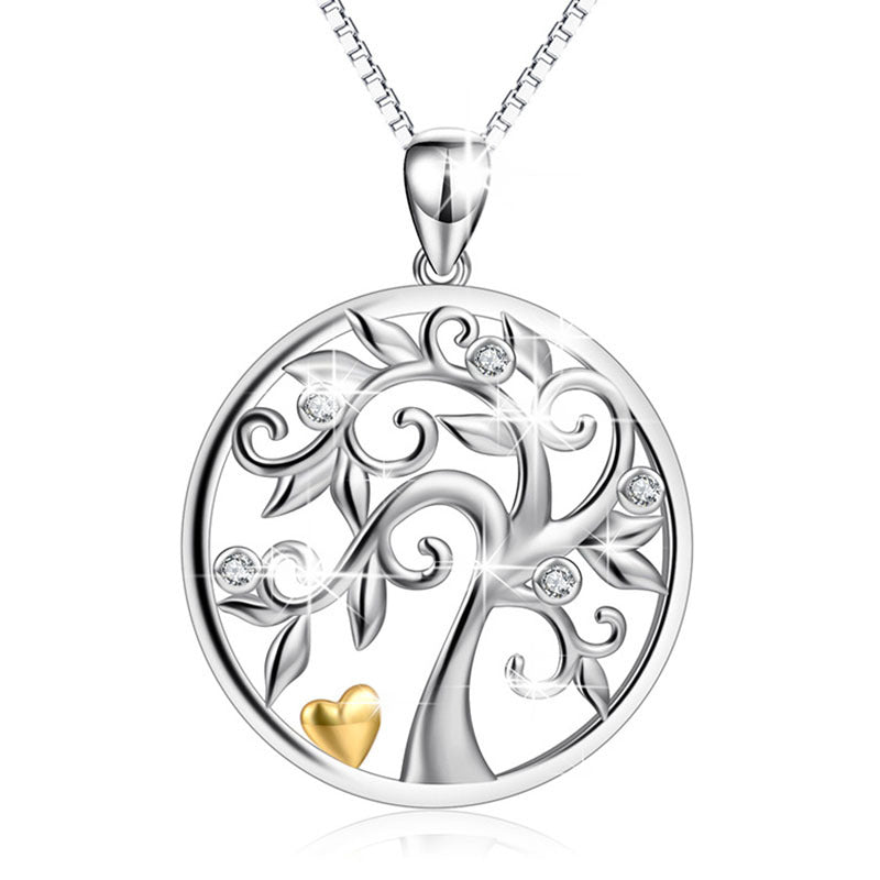 Collier Arbre de Vie en Argent 925 avec un cœur doré et des zircons incrustés, symbole de force et de nature.