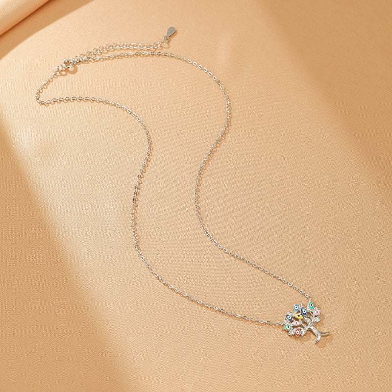 Collier Arbre de Vie Éclat Céleste en Argent 925 orné de breloques œil du mauvais œil multicolores.