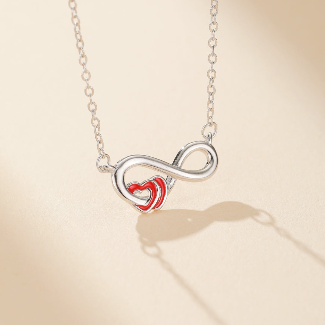 Collier en argent 925 avec un symbole de l'infini entrelacé avec un cœur rouge