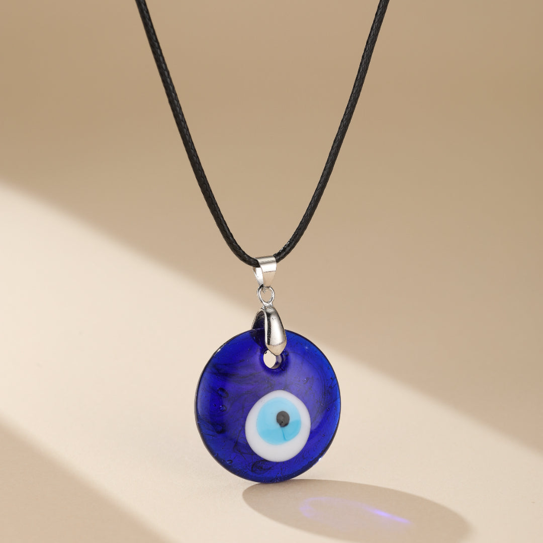 Collier Mauvais Œil Porte-Bonheur en verre, avec œil bleu turc de 3 cm, symbole de protection contre les énergies négatives et de chance.