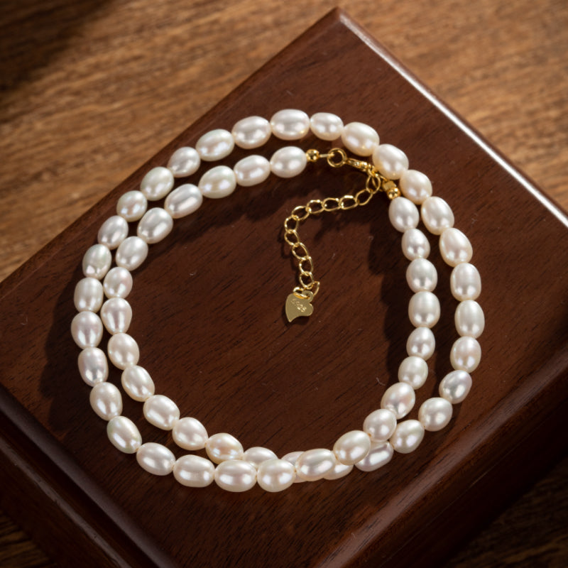 Bracelet double rang de perles d'eau douce blanches, fermoir et chaîne d'extension en argent plaqué or