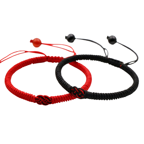 Le bracelet "Dragon" en deux coloris, noir et rouge, sur fond blanc