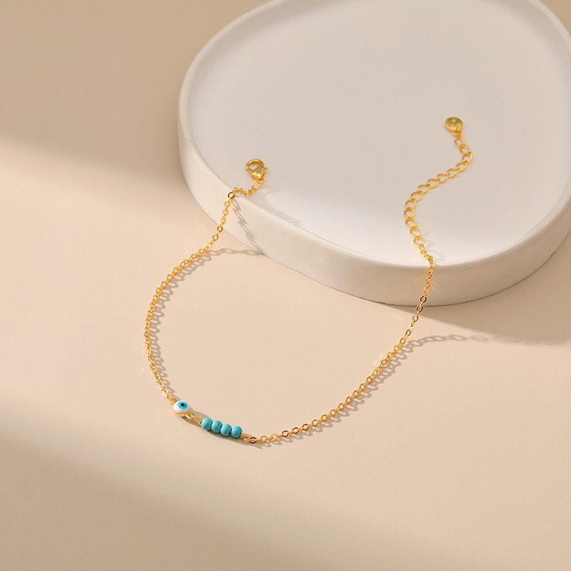Bracelet de Cheville – Perles Vertes et Œil Malicieux, Plaqué Or